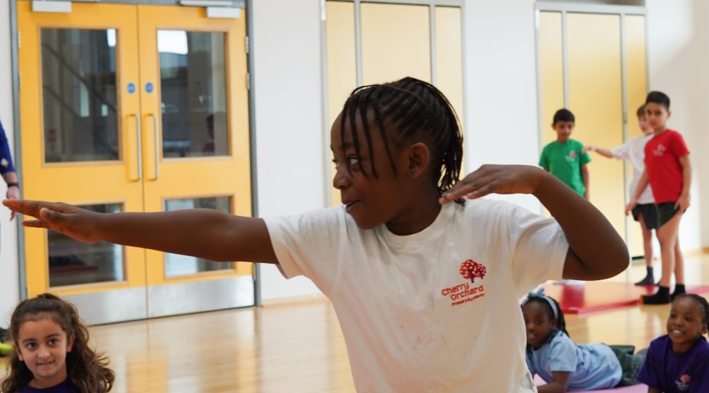 Young students exercising during a P.E. class.